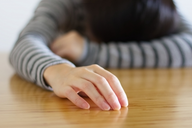しんどそうな母親